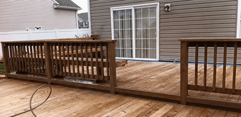 Deck sealing service protecting a backyard wood deck and railings in Bakersfield, CA