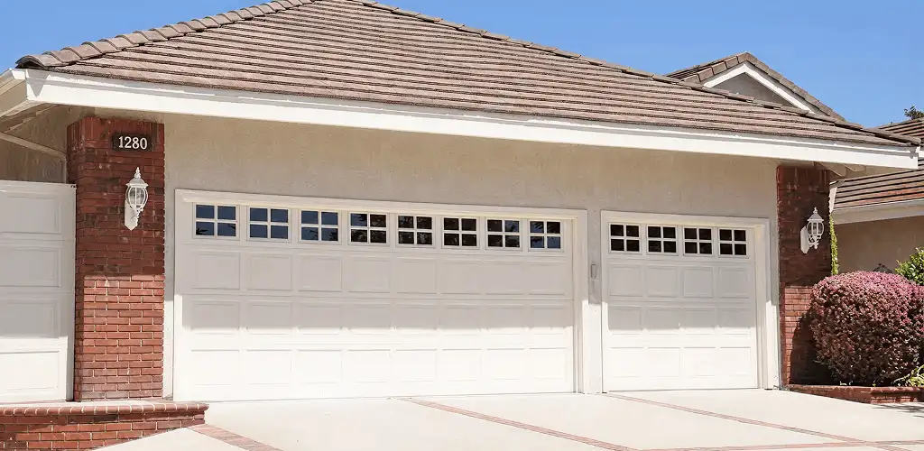 Residential garage door repair service for a double garage door in Bakersfield, CA