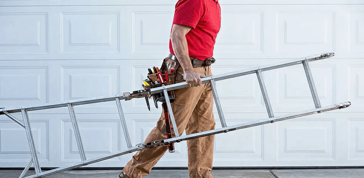 Garage door repair technician arriving with tools and ladder in Bakersfield, CA