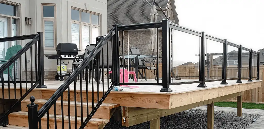 Handrail installation on a deck staircase for safety and code compliance in Bakersfield, CA